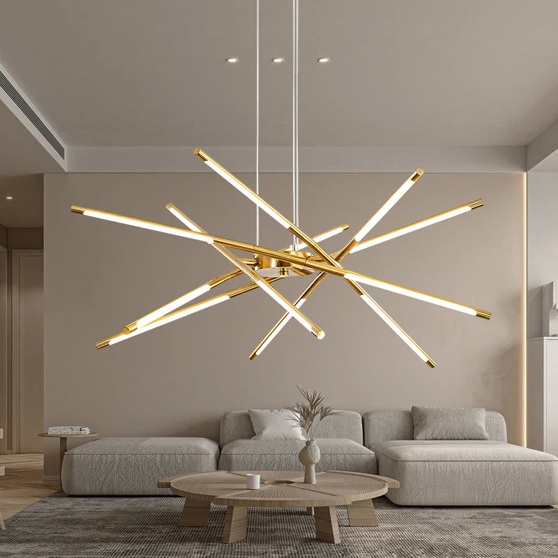 Modern chandelier in a living room with a gray sofa and wooden coffee table.